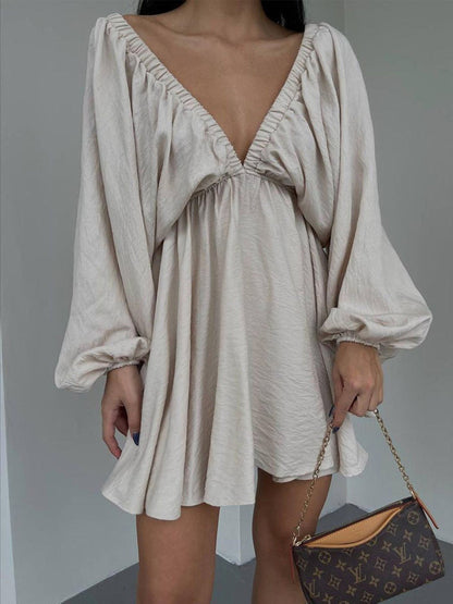 Mini skater dress made of fabric with deep neckline