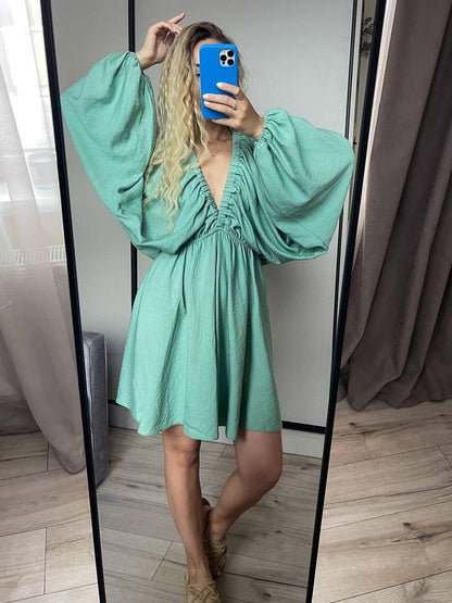Mini skater dress made of fabric with deep neckline